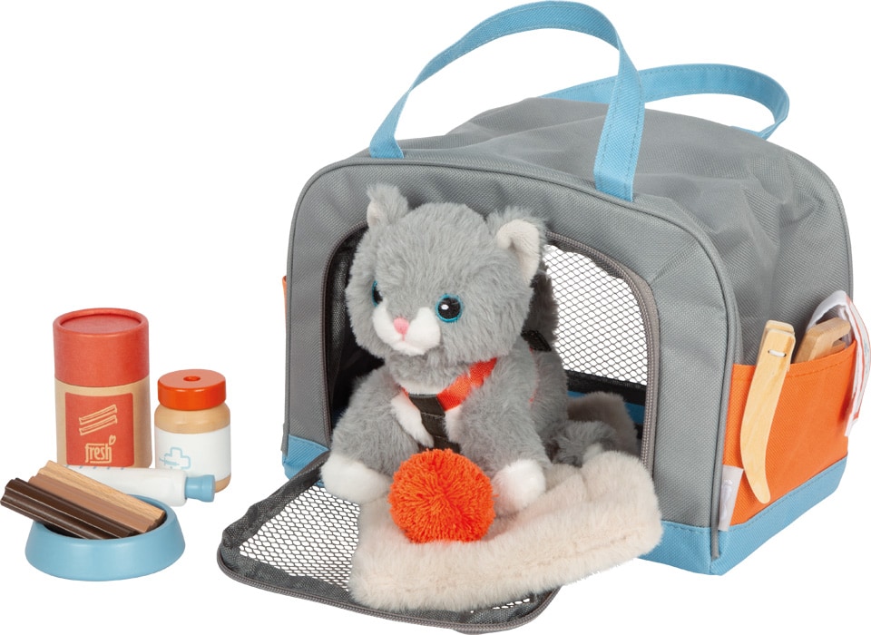 Katze mit Tasche und Pflege-Set